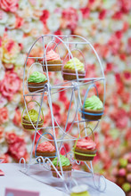 Colorful Cupcakes On A Small Ferris Wheel