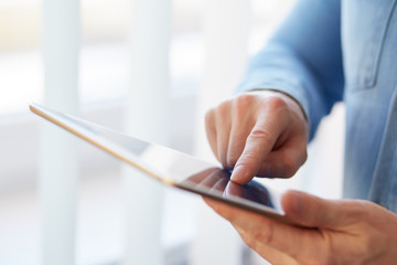 Wall Mural - man holding digital tablet