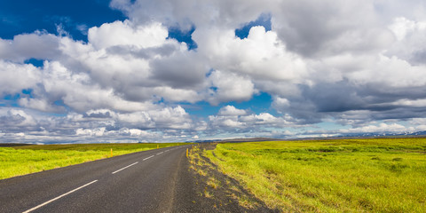 Isolated road and Icelandic colorful landscape on Iceland, summe