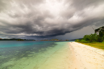 Wall Mural - Tropical storm offshore on Indonesian coastline and scenic beach