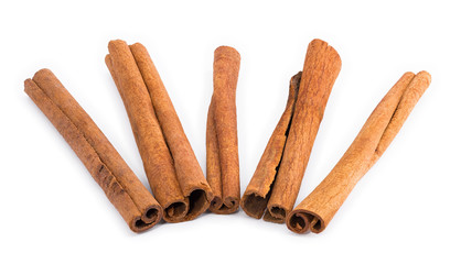 Five cinnamon sticks arranged like a fan.