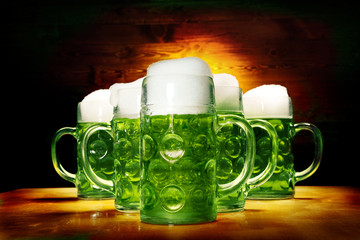 Wall Mural - Five Green Beer Glasses on the Wooden Table