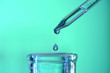Laboratory Pipette Droping Liquid into Glassware