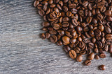Fototapeta Panele - Coffee Beans On Wood Background