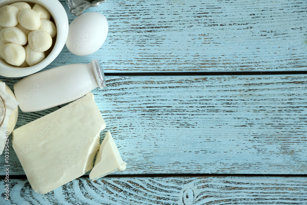 Frame of fresh dairy products on blue wooden table