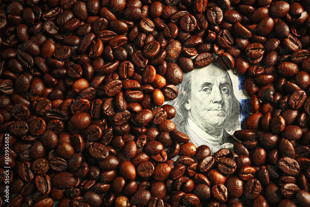 Coffee beans and US dollar banknote