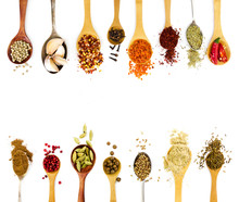 Spices In Spoons Isolated On White Background.