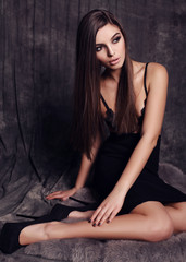 Sticker - fashion studio photo of beautiful young woman with dark hair and evening makeup