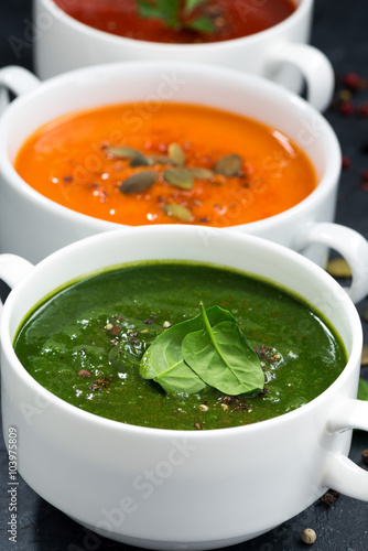 Naklejka - mata magnetyczna na lodówkę assortment of fresh vegetable cream soup on a black background