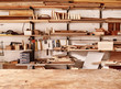 © mavoimages - Shelves in woodwork workshop with various wooden items and tools