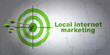 Marketing concept: target and Local Internet Marketing on wall background