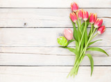 Fototapeta Tulipany - Colorful tulip bouquet and easter eggs