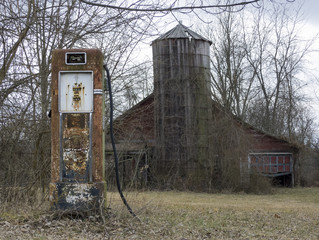 Wall Mural - Abandoned Gas Pump and Barn - An old ruined barn and a early 20th c. gasoline pump in a farm field