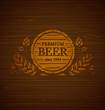 
Vector template beer emblem on a wooden background