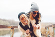 © sergiubirca - Outdoor lifestyle portrait of two best friends, smiling and having fun together, enjoy each other company posing and making selfie pictures to each other and share happiness