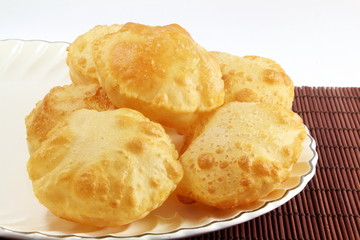 puri or Poori traditional indian homemade deep fried bread or chapati