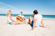 © Sergey Nivens - Beautiful young people with guitar on beach