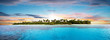 Leinwandbild Motiv Beautiful nonsettled tropical island in sunset