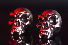  Two Metal Skull On A Black Background 