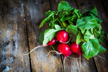Radishes On Rustic Wooden Background