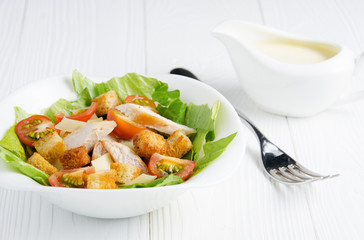 Caesar salad with sauce closeup