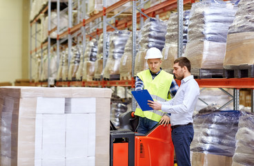 Wall Mural - worker and businessmen with clipboard at warehouse