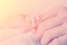 Newborn Baby Hand Touch On Mother Hand In Warm Tone, Vintage Pic