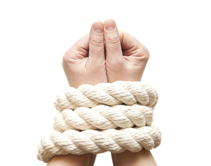 Hands tied  in rope on a white background