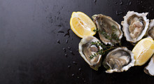 Fresh Oysters In Shell With Lemon