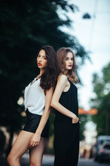 pretty girls posing in a city street