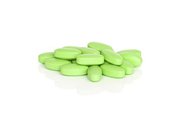 Wall Mural - Vitamin B Tablet Supplements. A pile of vitamin B supplement tablets isolated on a white background.