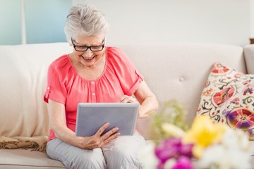 Senior woman using digital tablet