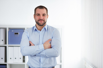 Wall Mural - Businessman stands in the office