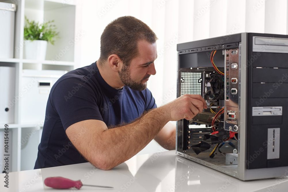 Man repairing computer