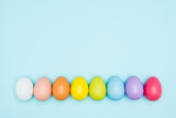 Fototapeta  - Colorful easter eggs on pastel background