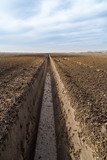 Fototapeta Kuchnia - Drainage canal at agricultural field