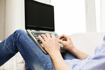 Sticker - close up of man typing on laptop computer at home