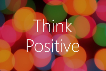 Think Positive text on colorful bokeh background