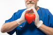 © kostyha - Doctor holding a red heart in the hands