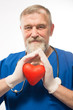 © kostyha - Doctor holding a red heart in the hands