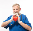© kostyha - Doctor holding a red heart in the hands