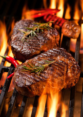 Wall Mural - Beef steaks on the grill