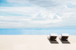 The beach in summer, clear sand and blue sky with beach chairs, idyllic travel background