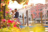 Fototapeta Konie - groom and bride kissing in Venice