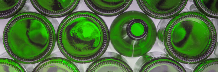 Beer bottles of green glass background, glass texture