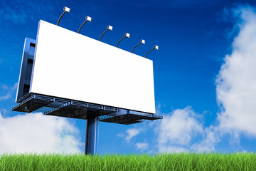 blank billboard with green field and blue sky