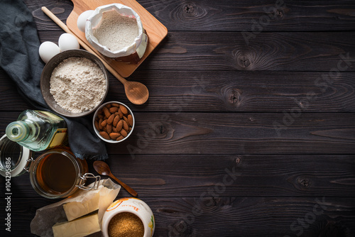 Fotografie, Obraz Ingredients for baking on a wooden background top view