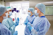 © Syda Productions - group of surgeons in operating room at hospital