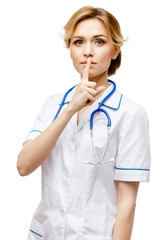 Woman doctor standing on white background