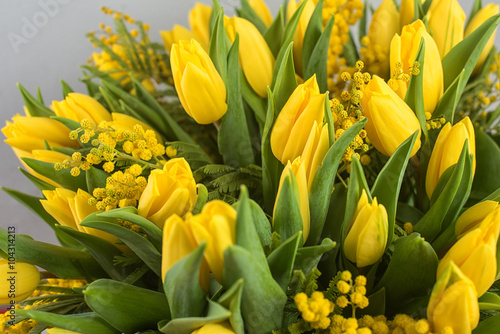 Naklejka nad blat kuchenny Bright spring bouquet of tulips and mimosa flowers